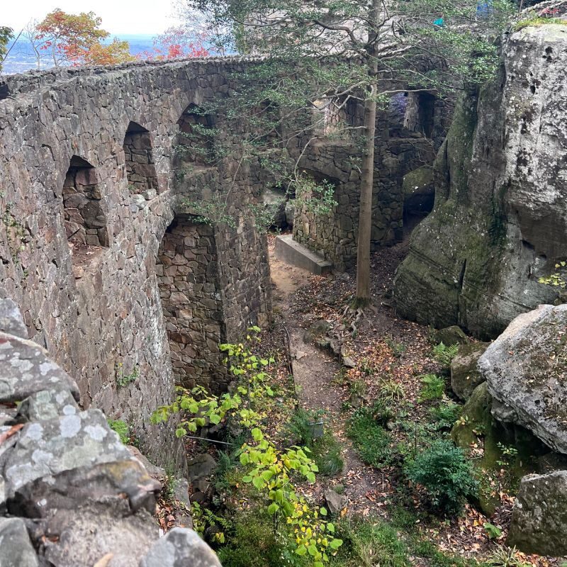 A stone walkway weaves through Rock City with archways appearing in it's face.