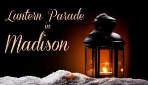 burning black vintage christmas lantern in the night on snow
