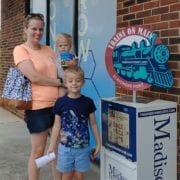 family enjoying Trains On Main scavenger hunt in Madison Alabama