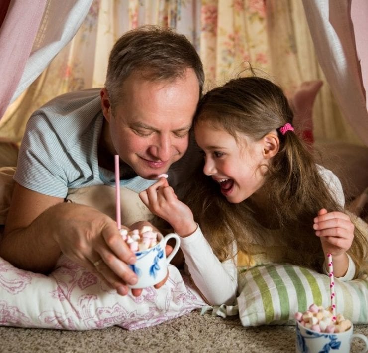 da and daughter drinking hot cocoa