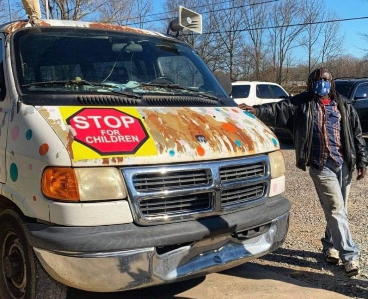 Mr. Bontu, the neighborhood's favorite ice cream man, stands beside his van that's in need of some repairs.