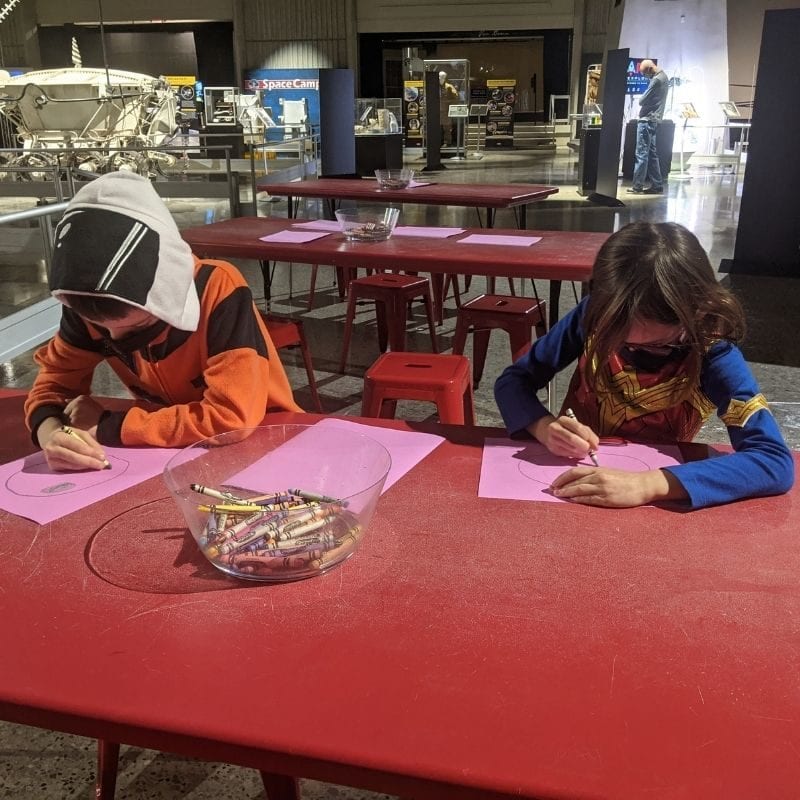 The new exhibit, Dare to Explore: Milestones to Mars, includes a section for visitors to draw their own space habitats.