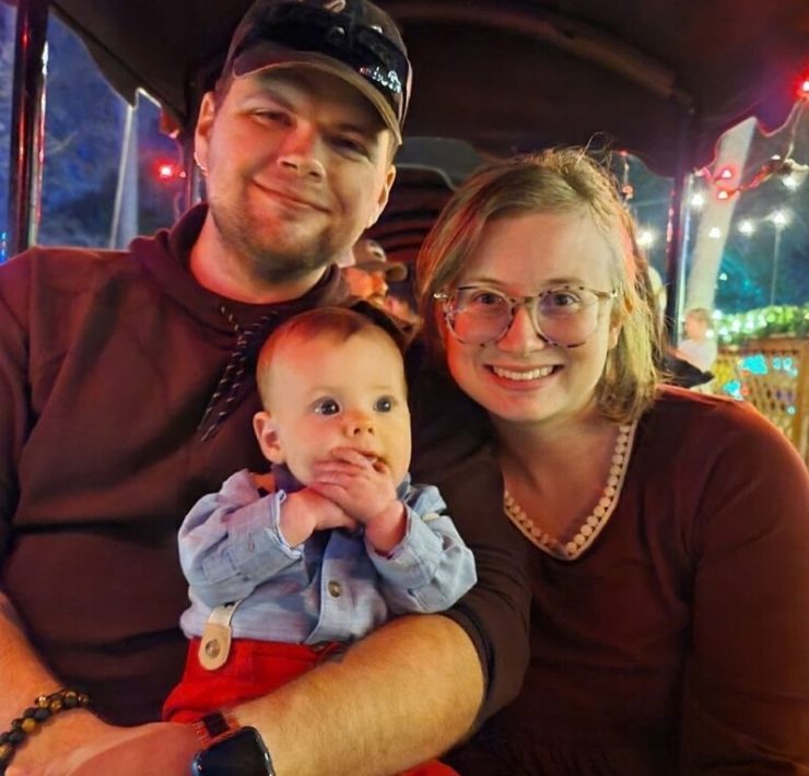 A family sits aboard the train at Noccalula Falls Park during Christmas at the Falls.