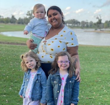 An au pair in America participant poses with her family.