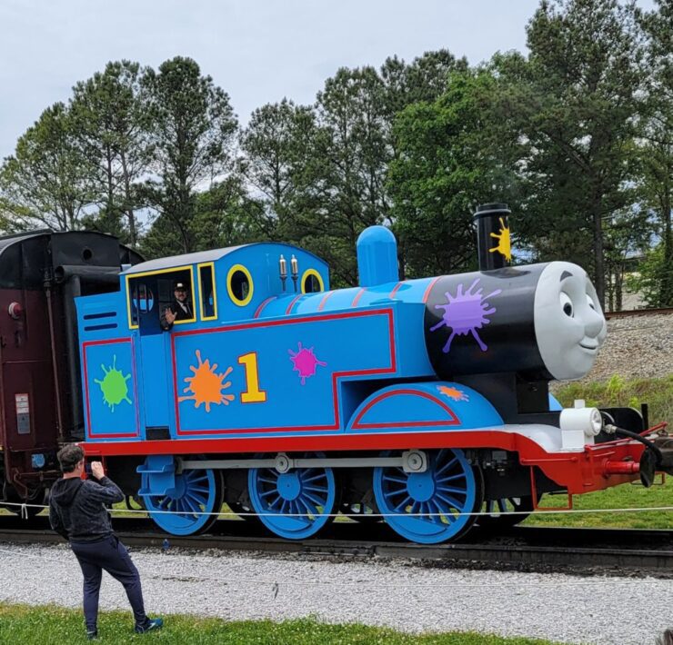 A Thomas the Train engine replica waits on the tracks for a special train ride at the Tennessee Valley Railroad Museum.