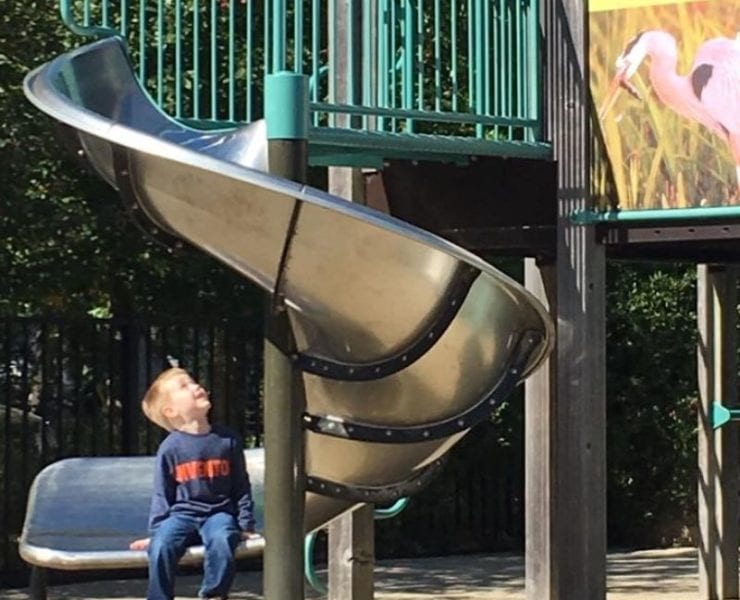 Delano Park in Decatur AL boy on slide