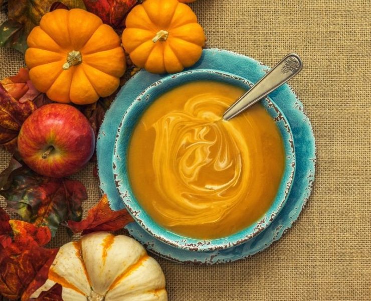 bowl of pumpkin soup on a Fall tablescape