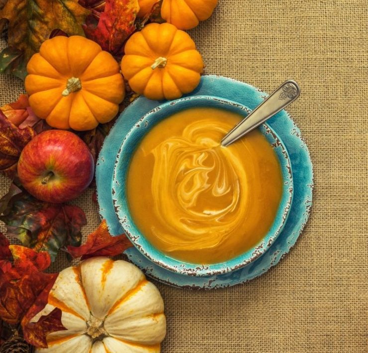 bowl of pumpkin soup on a Fall tablescape