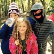 three lids smiling while camping at Monte Sano state park in huntsville