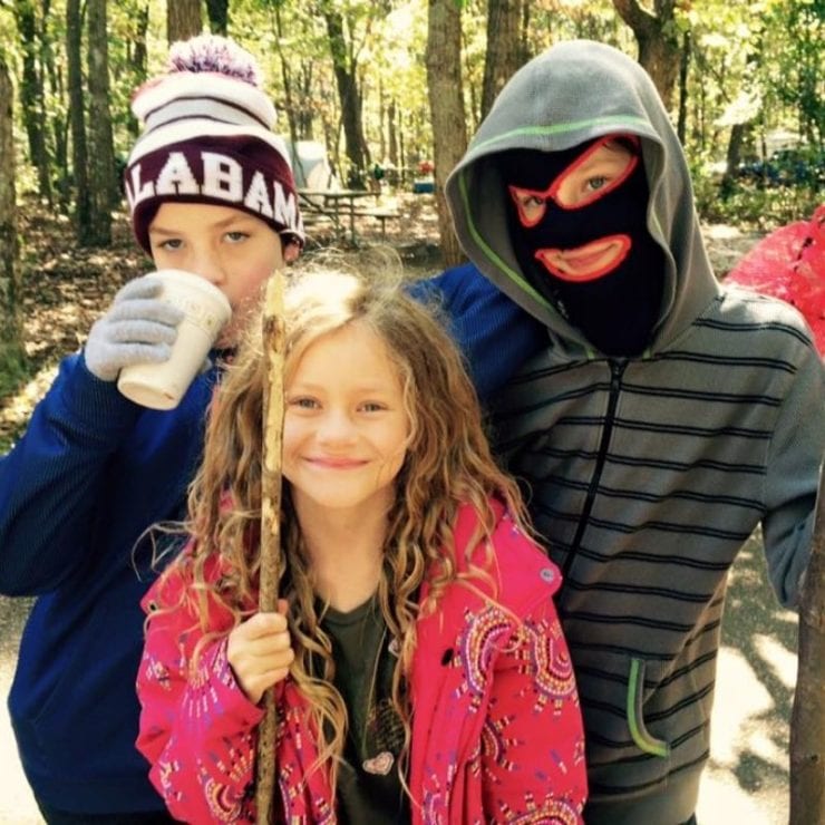 three lids smiling while camping at Monte Sano state park in huntsville