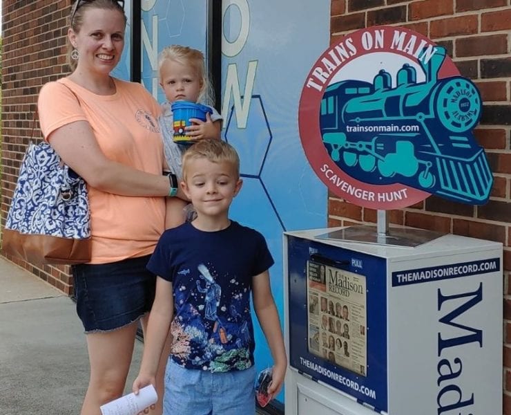 family enjoying Trains On Main scavenger hunt in Madison Alabama