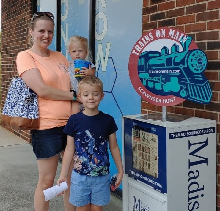 family enjoying Trains On Main scavenger hunt in Madison Alabama