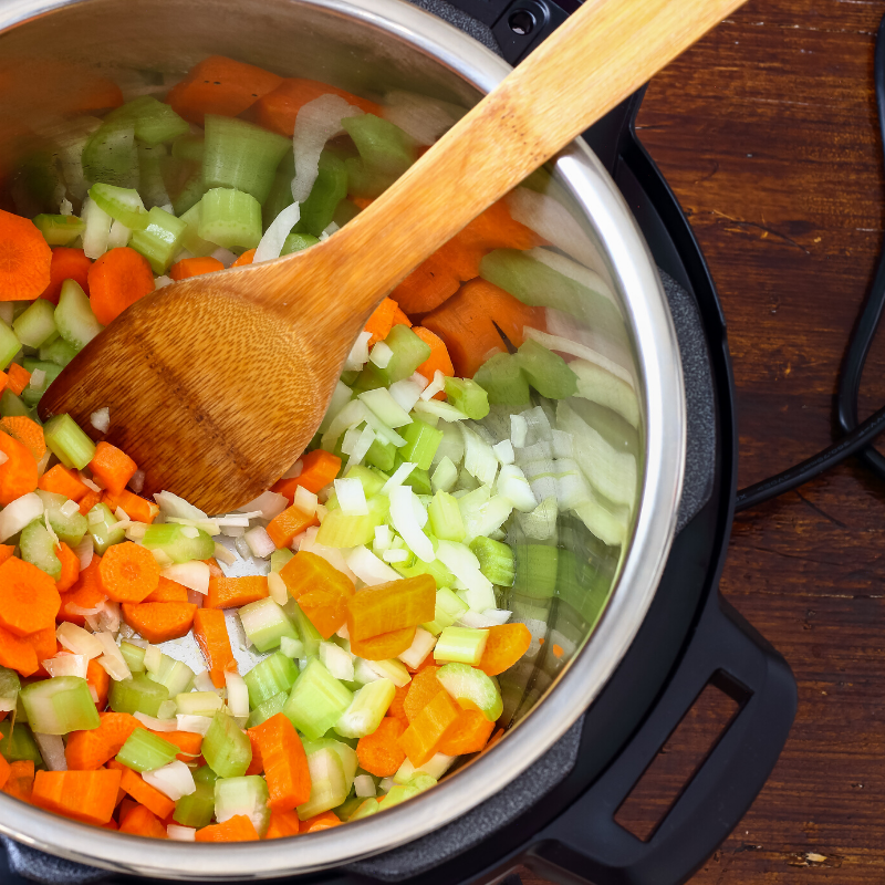 instant pot pressure cooker sautéing carrots onions and celery