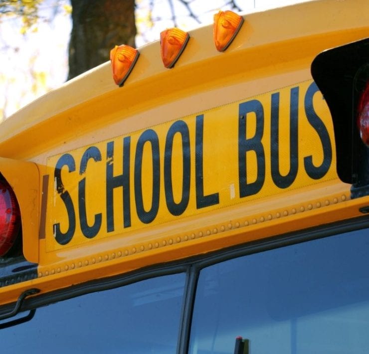 front of a yellow school bus