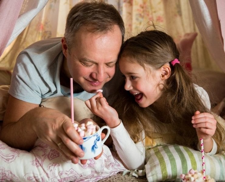 da and daughter drinking hot cocoa