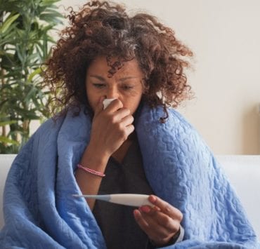 sick woman on the couch
