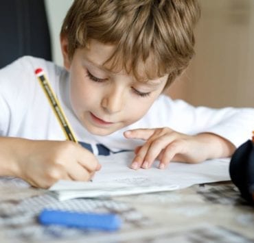 boy working at desk at home