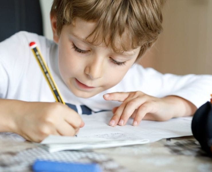 boy working at desk at home