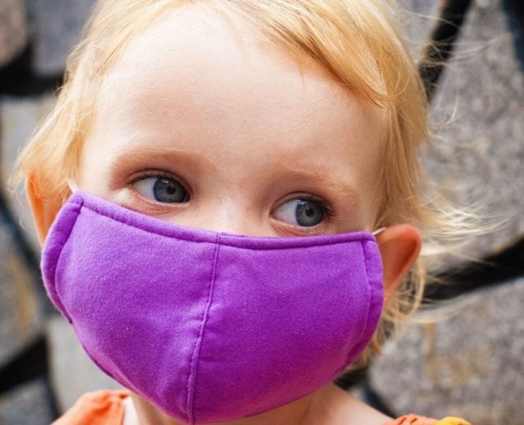 young girl wearing mask