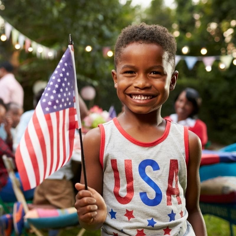 4th of July iboy holding American flag