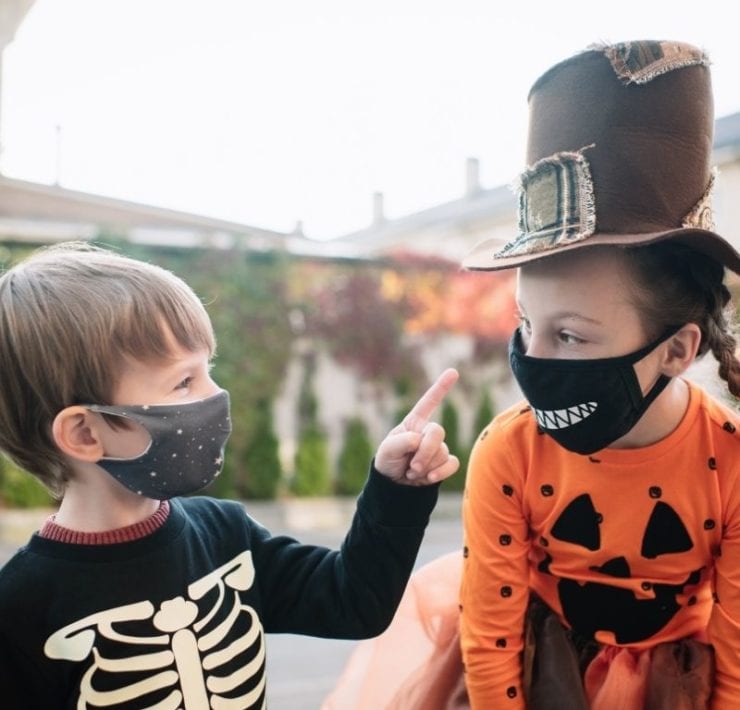 trick or treating children wearing masks