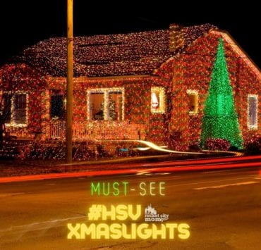 house strung with lots of Christmas lights