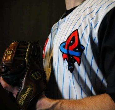 baseball player in Rocket City Trash Panda uniform
