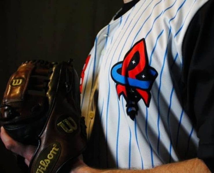 baseball player in Rocket City Trash Panda uniform
