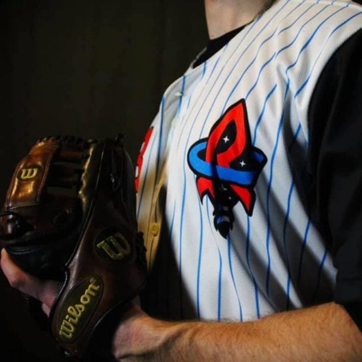 baseball player in Rocket City Trash Panda uniform
