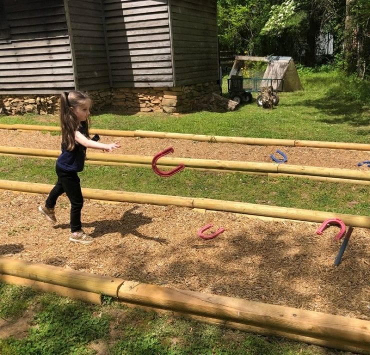 After completing your GeoQuest adventure, celebrate with a game of horseshoes.