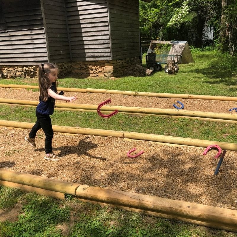 After completing your GeoQuest adventure, celebrate with a game of horseshoes.