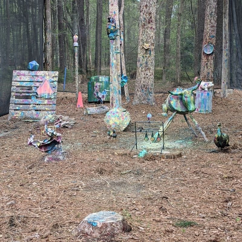 Paint splattered targets make up the paintball area of GoFar USA Park.