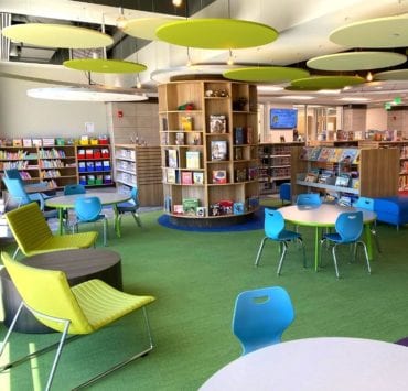 colorful tables and chairs in the kids section of the new North Huntsville Library