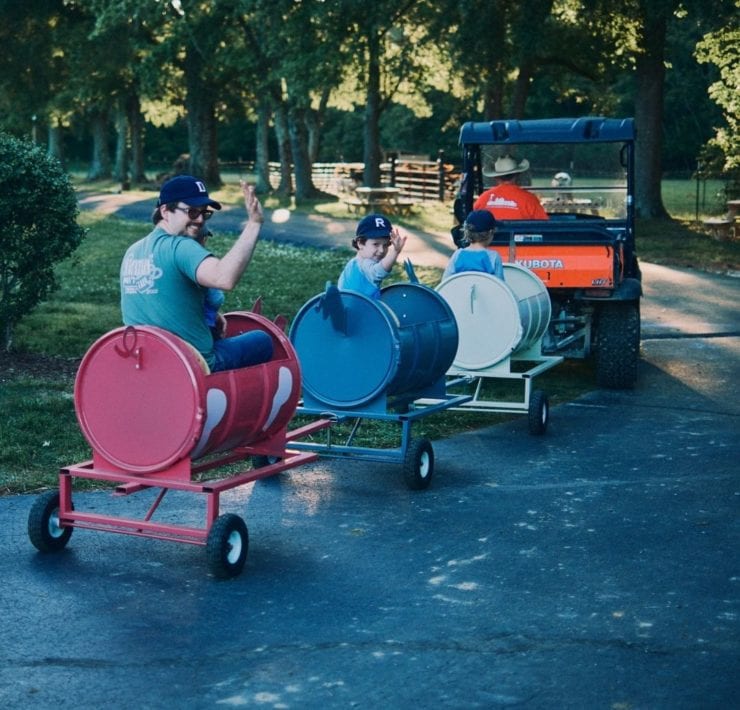 Guests enjoy a "train" ride behind Scott's kubota.