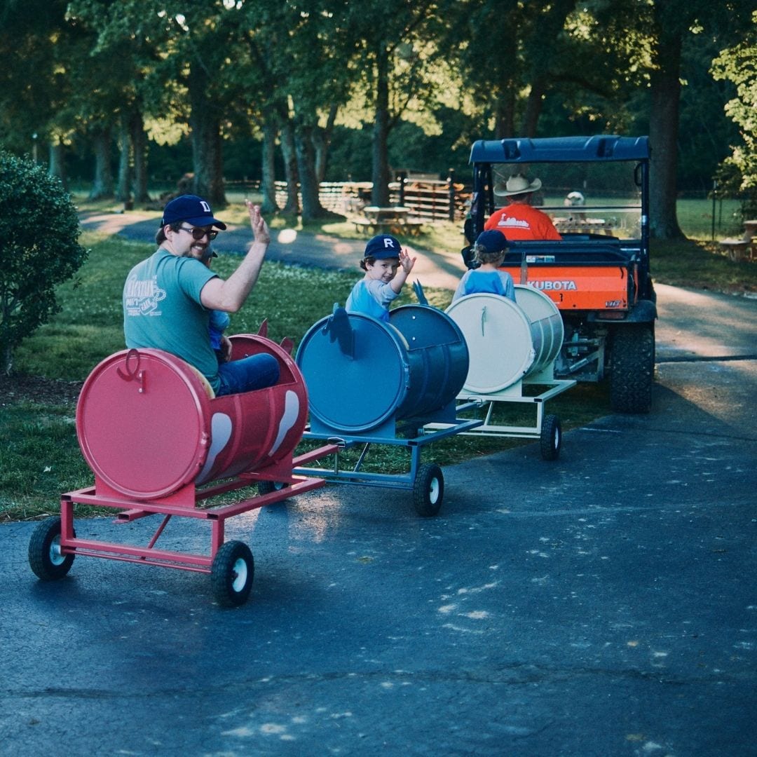 Guests enjoy a "train" ride behind Scott's kubota.