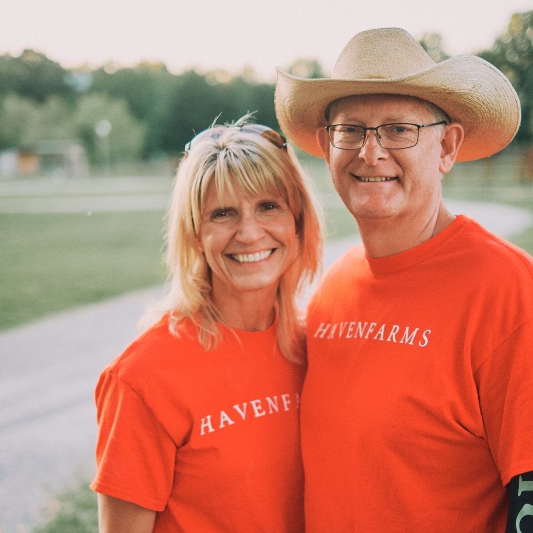 LeAnn and Scott Newsom proudly wear their Haven Farms tshirts on the quaint farm property in Hazel Green.