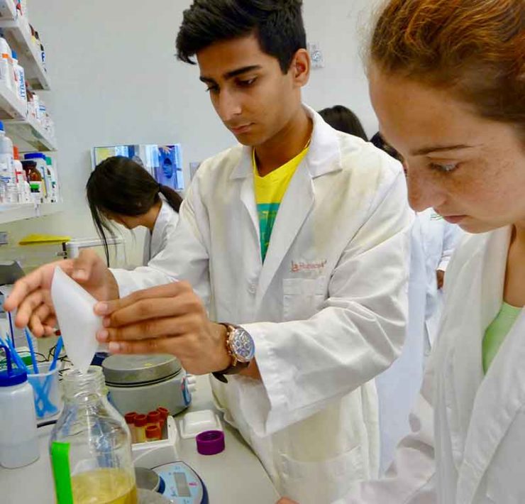 three teen students working in a lab at HudsonAlpha in Huntsville, Alabama
