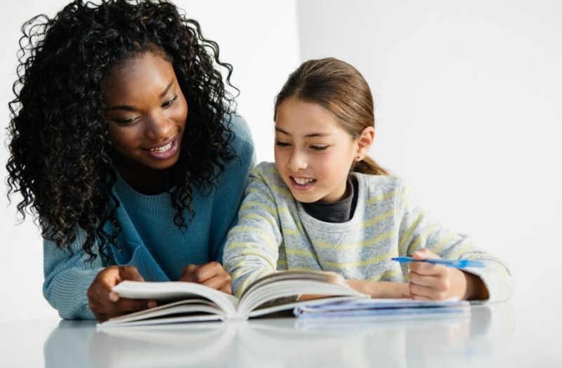 girl studying with her tutor