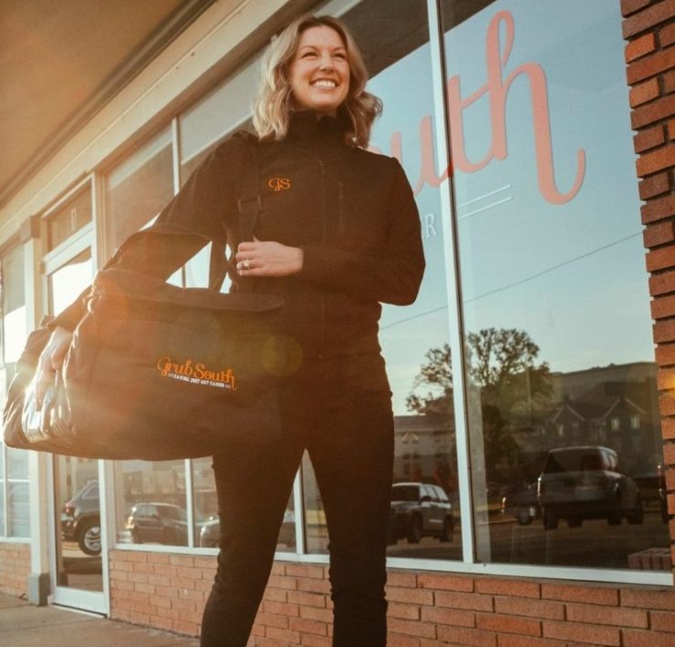 young woman delivering food for GrubSouth food delivery service in Huntsville