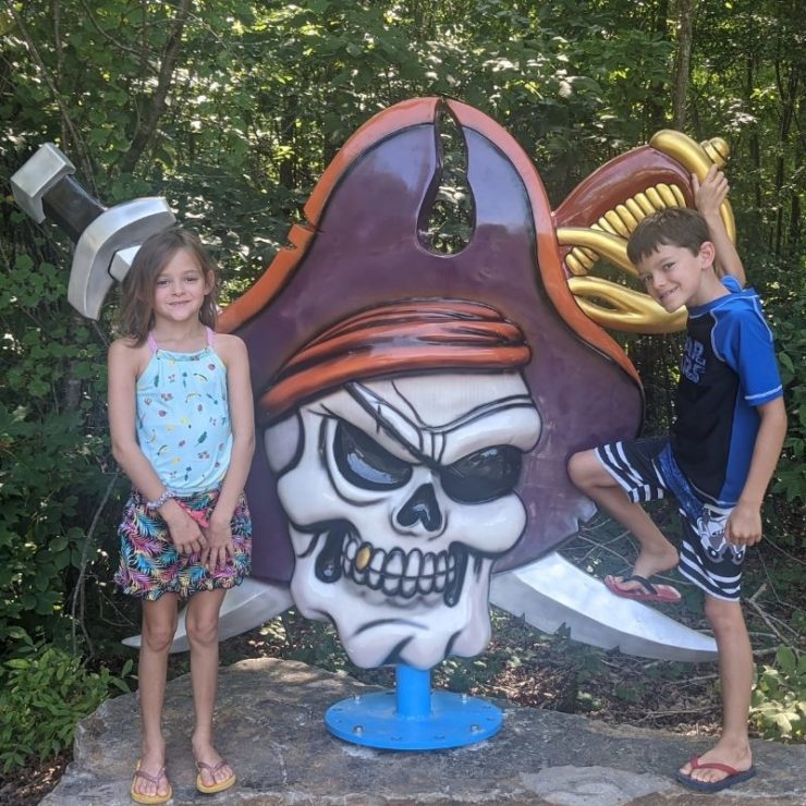 A pirate skull in front of two cross swords mark the entrance to Pirate's Bay waterpark in Leesburg.