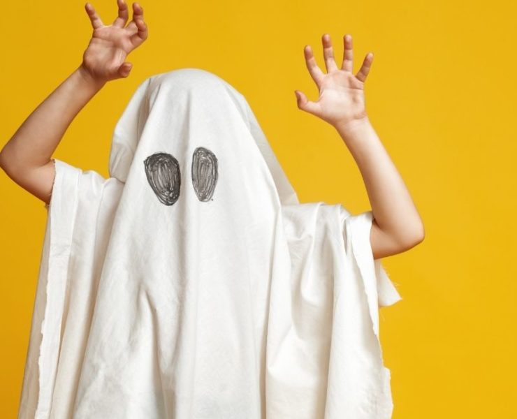child in a ghost costume