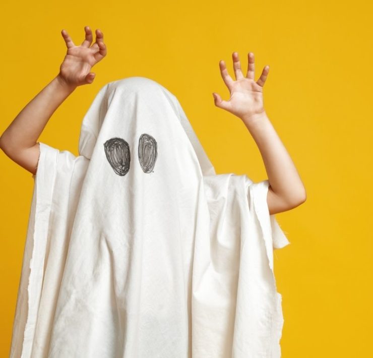 child in a ghost costume