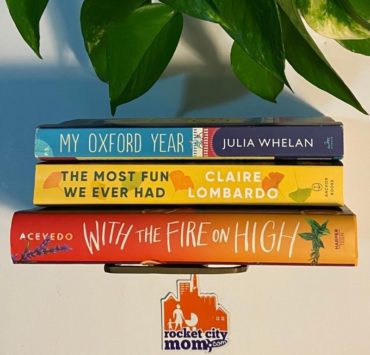 stack of book titles from the Rocket City Mom book club in huntsville AL