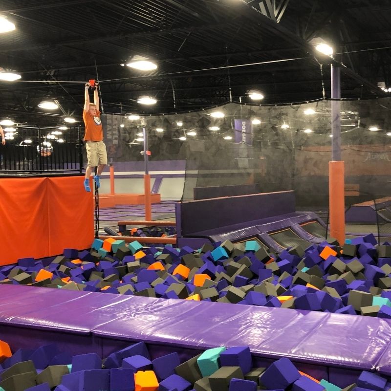 crossing the zip line at Altitude trampoline park
