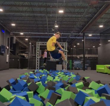 boy jumping into the foam pit