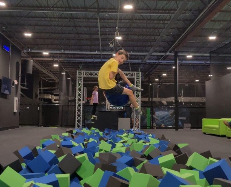 boy jumping into the foam pit