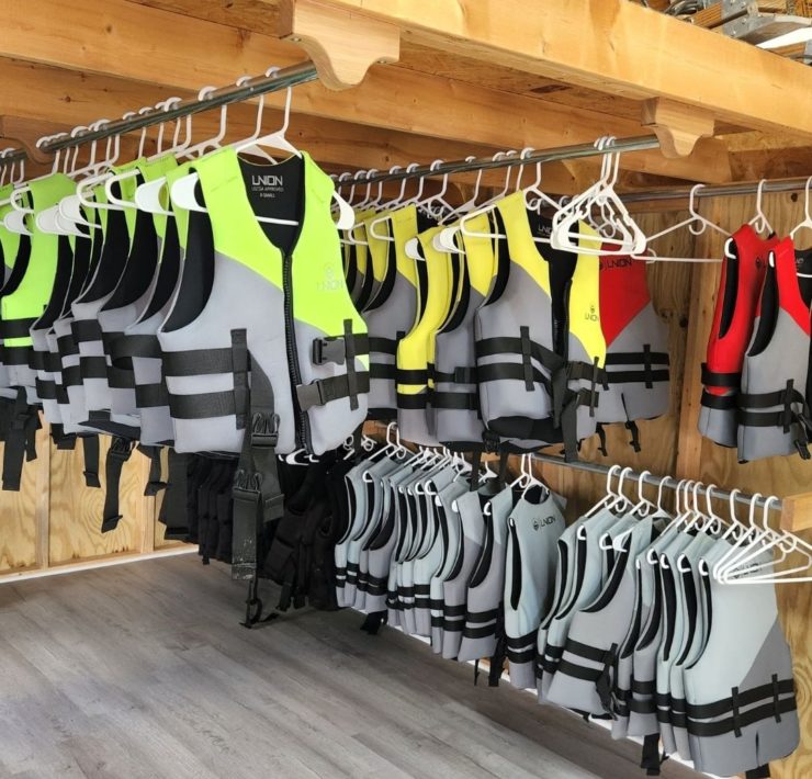 Shelves of life jackets in varying sizes are available at Slippery Summit Aqua Park.