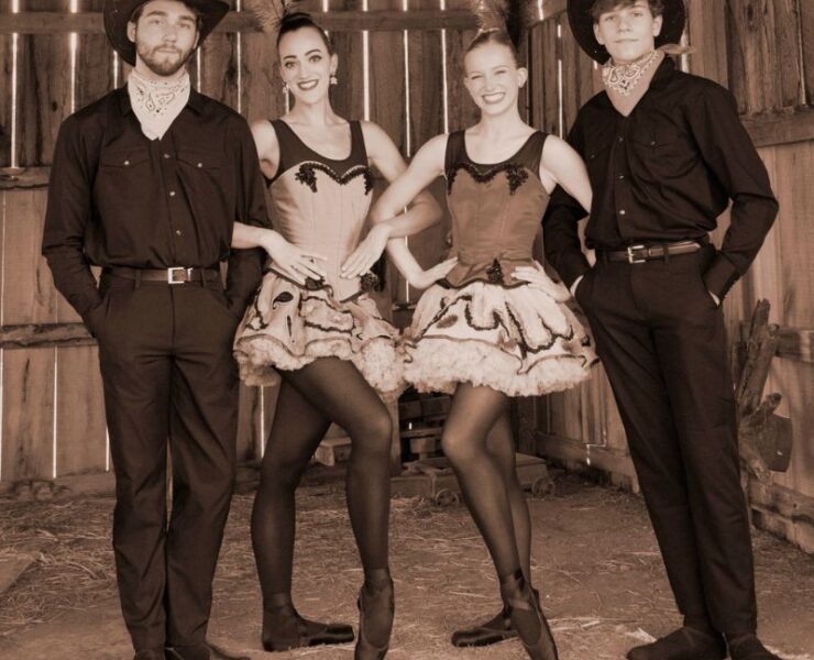Four ballet performers from Huntsville Ballet's Tumbleweed Suite stand together in costume.