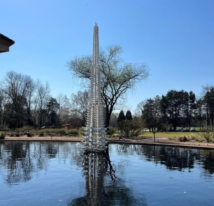 A 25-foot tall sculpture made up of tiny peace cranes tower over the aquatic garden for Origami in the Garden.