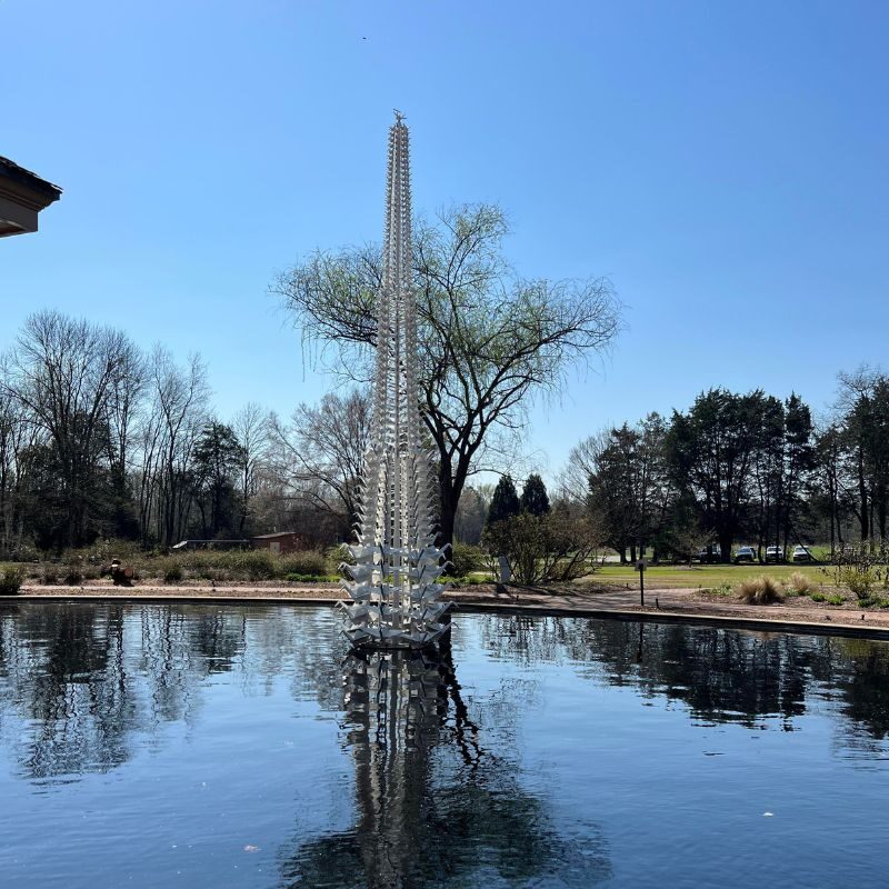 A 25-foot tall sculpture made up of tiny peace cranes tower over the aquatic garden for Origami in the Garden.